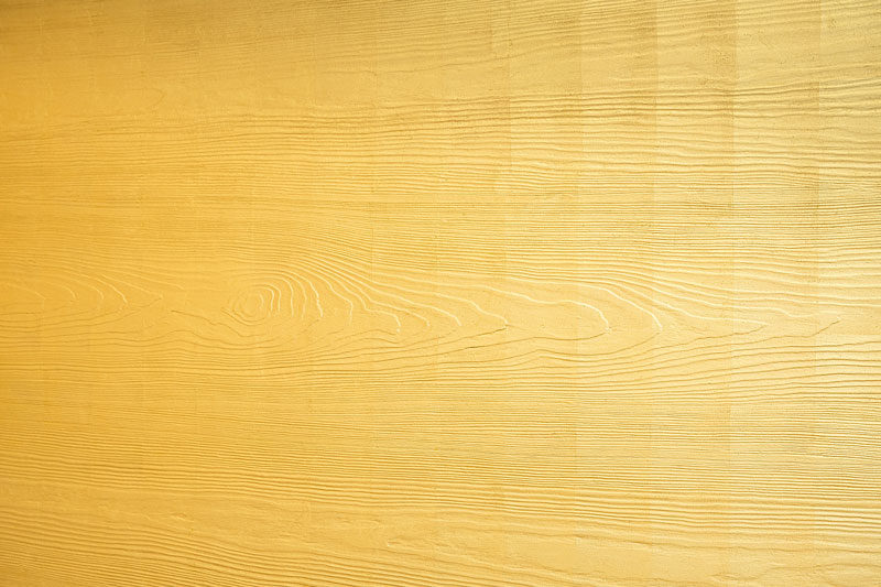 Detail mit vergoldeter Holzmaserung